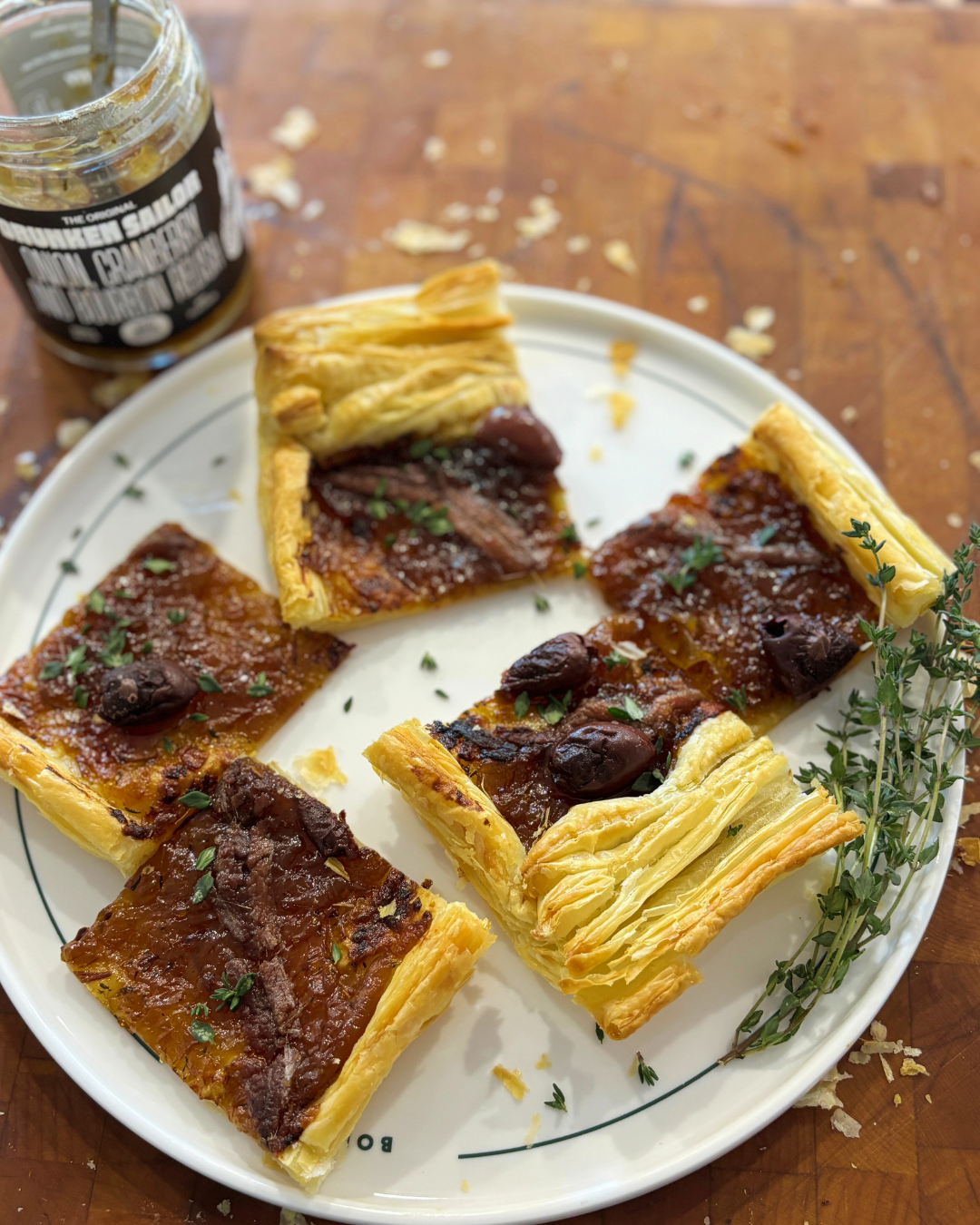 Pissaladière: Anchovy & Olive tart with Drunken Sailor Onion, Cranberry & Bourbon Relish